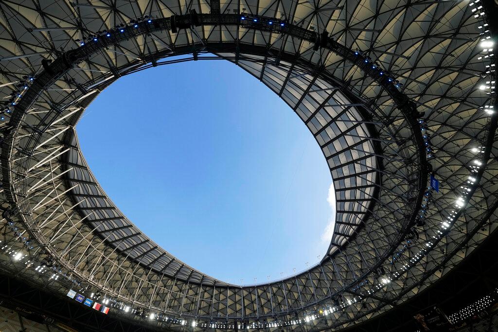 The flags of Argentina and France hang from the roof of the stadium ahead of the World Cup final soccer match between Argentina and France at the Lusail Stadium in Lusail, Qatar, Sunday, Dec. 18, 2022.