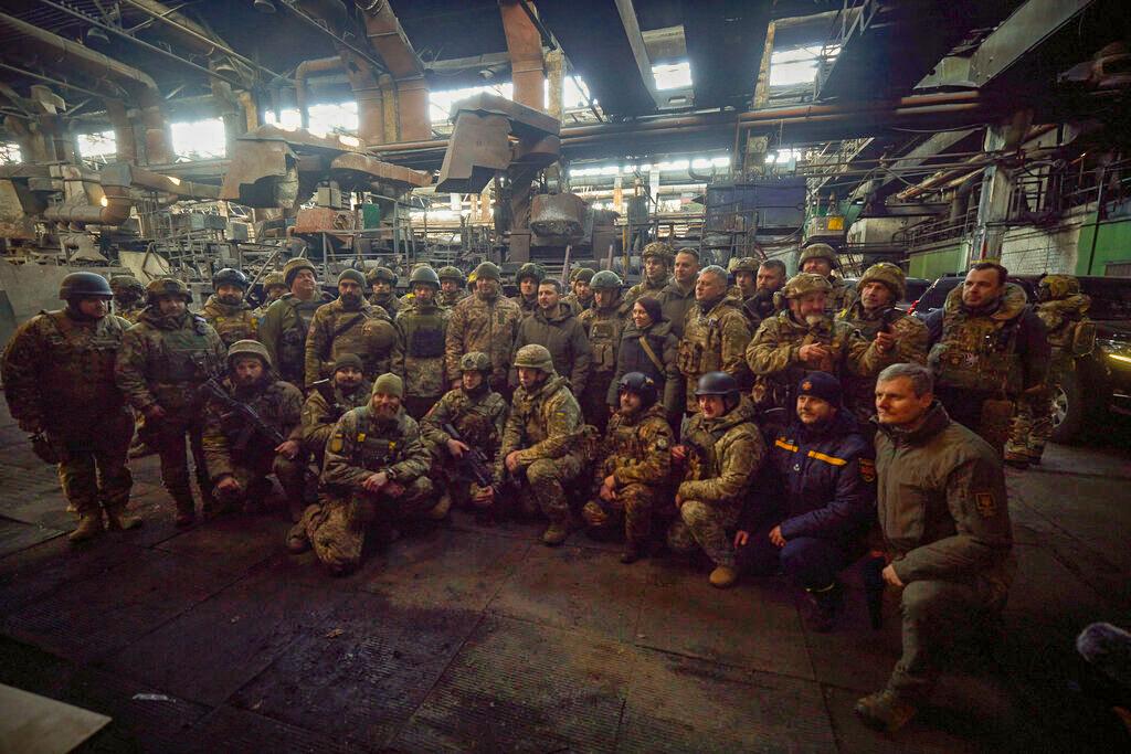 Ukrainian President Volodymyr Zelenskyy, center, with soldiers at the site of the heaviest battles with the Russian invaders in Bakhmut, Ukraine