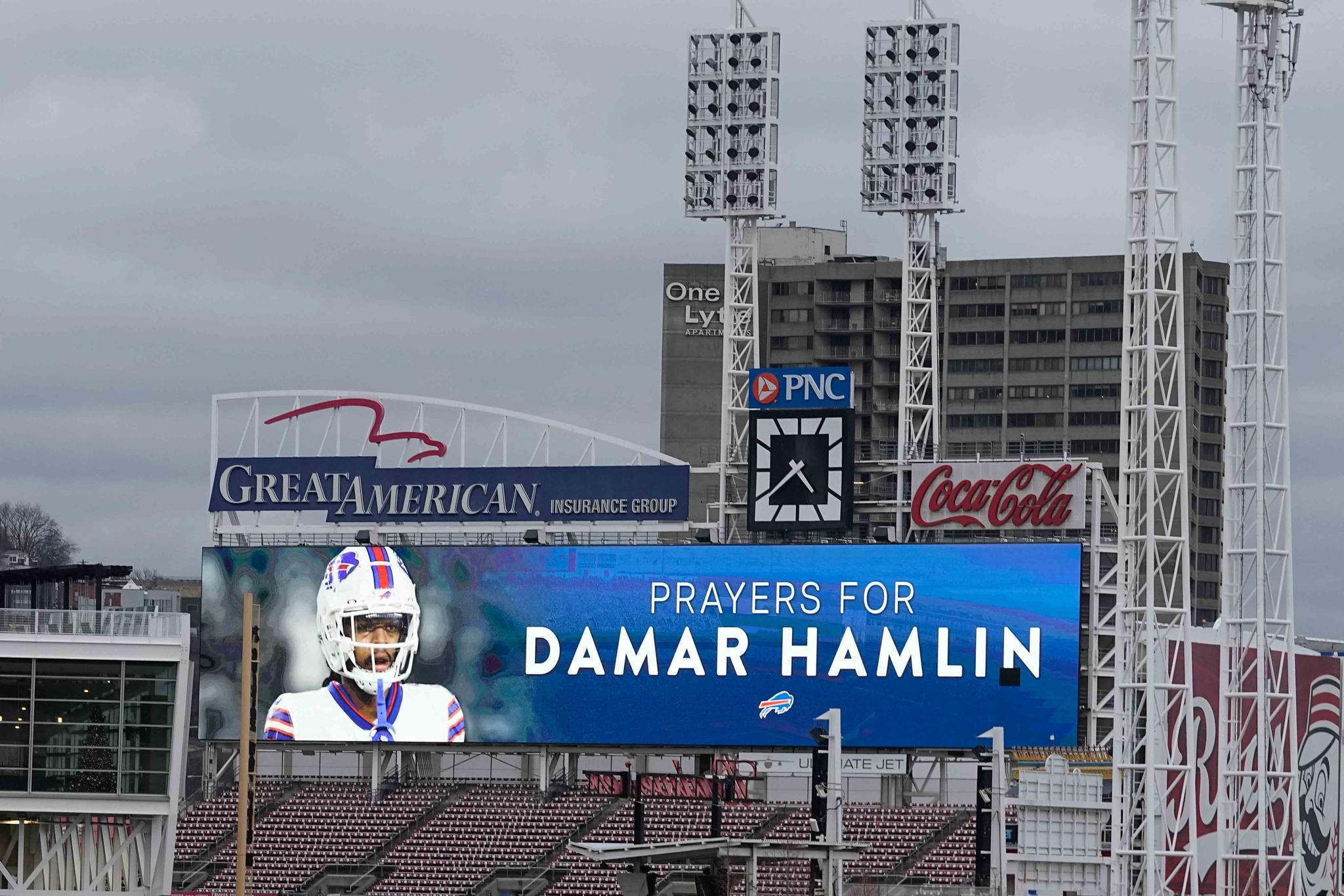 A scoreboard at Great American Ballpark displays a photo of Buffalo Bills' Damar Hamlin, Tuesday, Jan. 3, 2023, in Cincinnati.