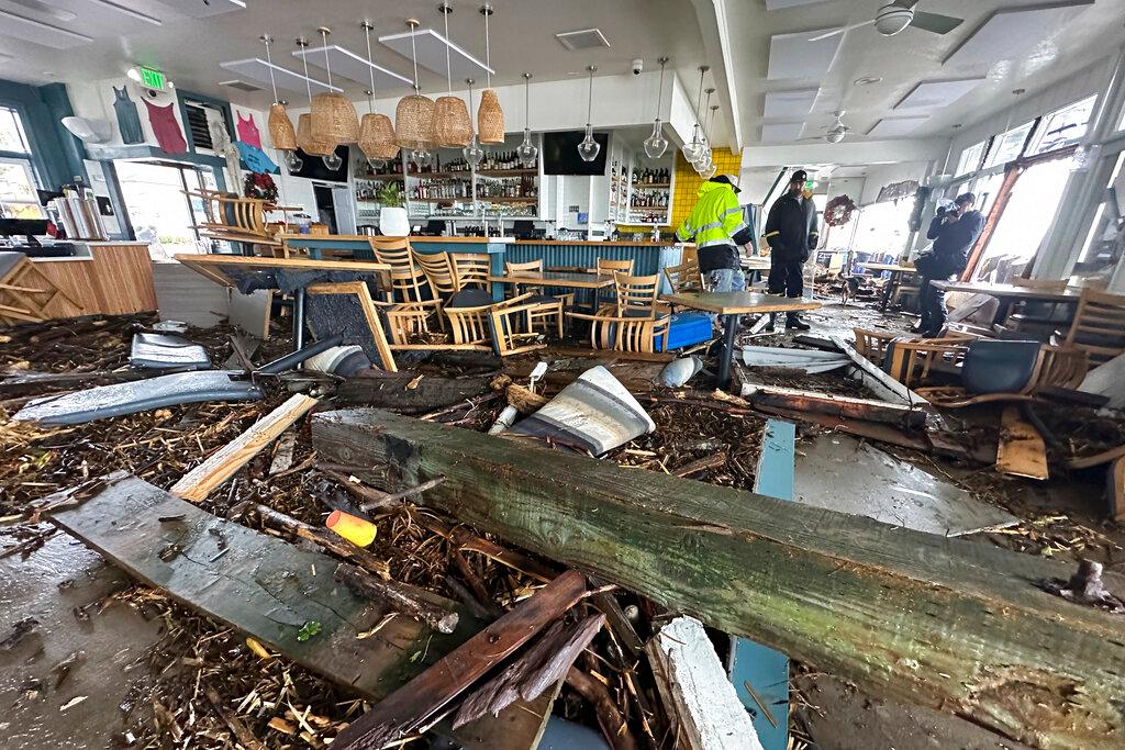 A support piece from the Capitola Wharf is seen inside the storm damaged Zelda's restaurant in Capitola, Calif.