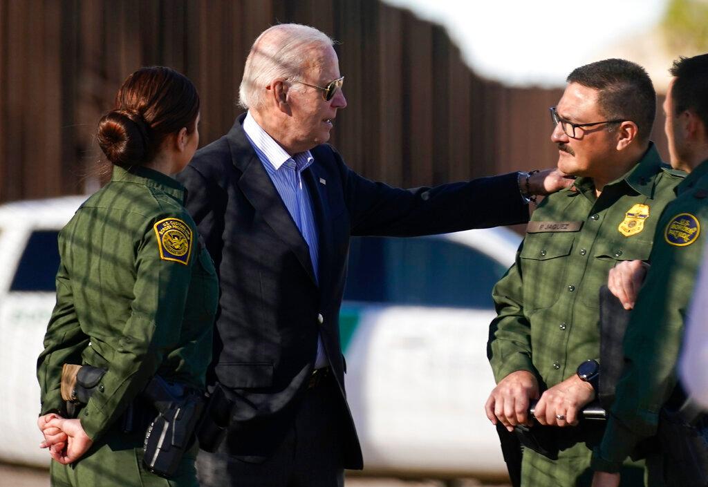 President Joe Biden talks with U.S. Border Patrol agents.