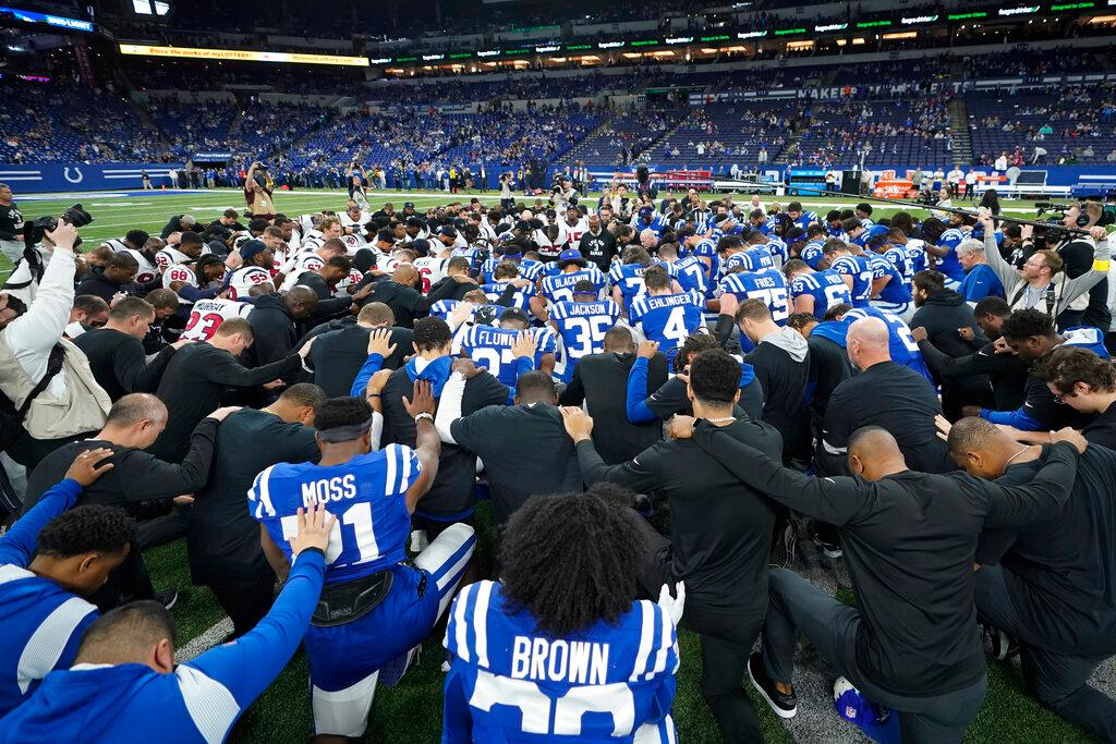 The Houston Texans and Indianapolis Colts gather on the field before their NFL football game in support of Buffalo Bills safety Damar Hamlin