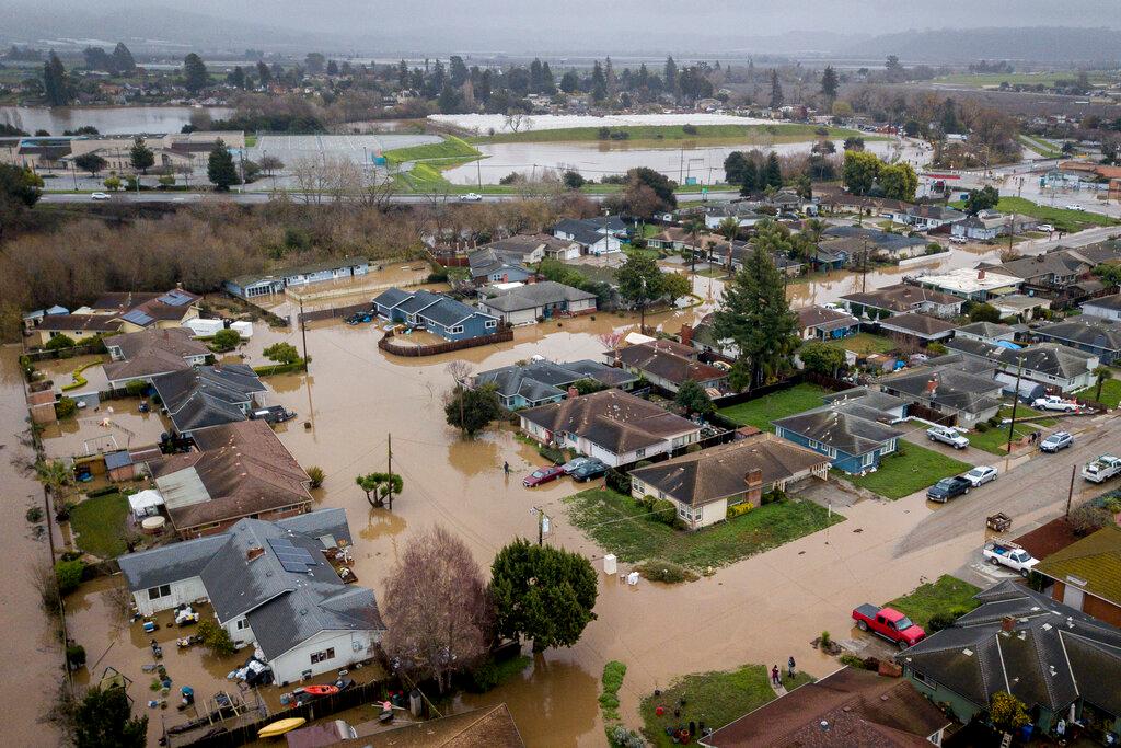 Flooding from huge amounts of rain are seen in a neighborhood near Watsonville, Calif.