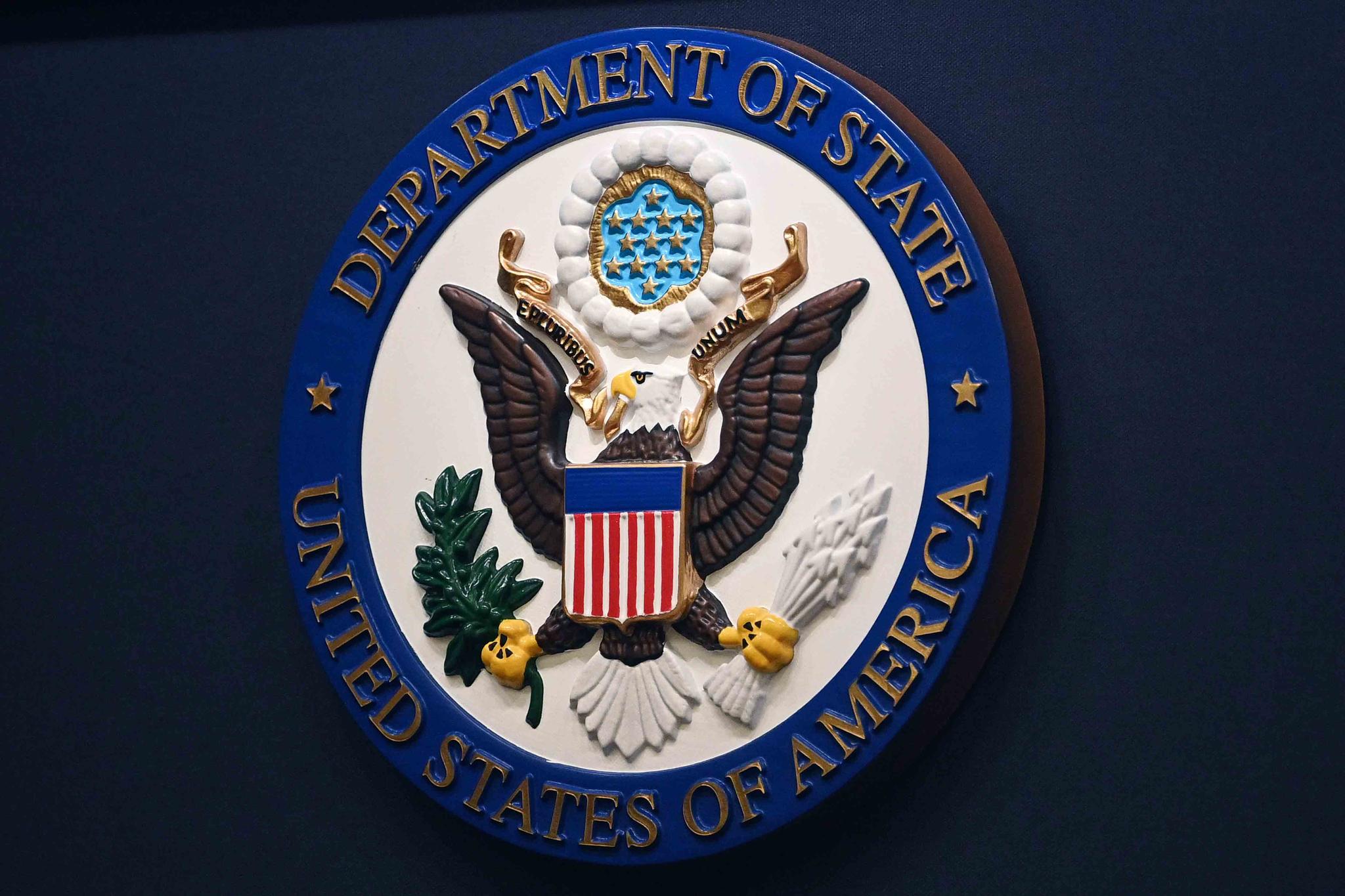 The State Department seal is seen on the briefing room lectern at the State Department in Washington, Jan. 31, 2022.