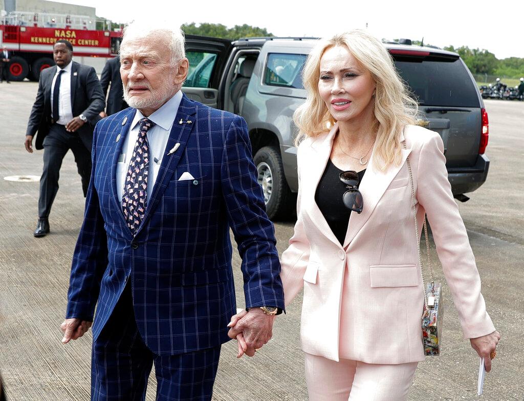 Apollo 11 astronaut Buzz Aldrin, left, and Anca Faur arrive at the Kennedy Space Center