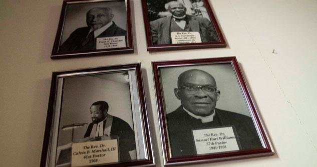 Four framed photos of Black pastors from the past