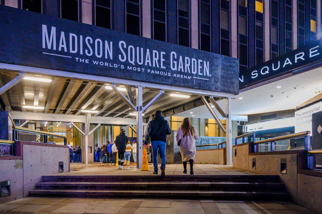 Fans line up outside Madison Square Garden before an NBA basketball game between the New York Knicks and the Golden State Warriors in New York, Feb. 23, 2021. New York's attorney general said Wednesday, Jan. 25, 2023, that Madison Square Garden may be violating anti-bias laws with its practice of barring lawyers from firms involved in litigation against MSG from its venues including Radio City Music Hall and the Garden itself.