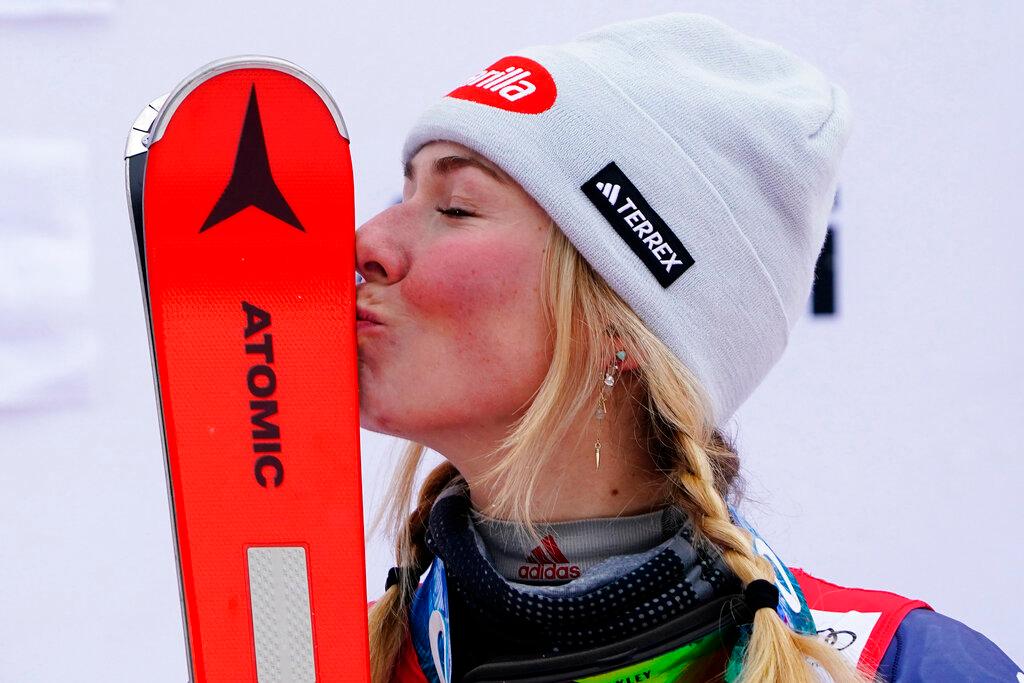 United States' Mikaela Shiffrin kisses her skis after winning an alpine ski, women's World Cup slalom, in Spindleruv Mlyn, Czech Republic, Saturday, Jan. 28, 2023.