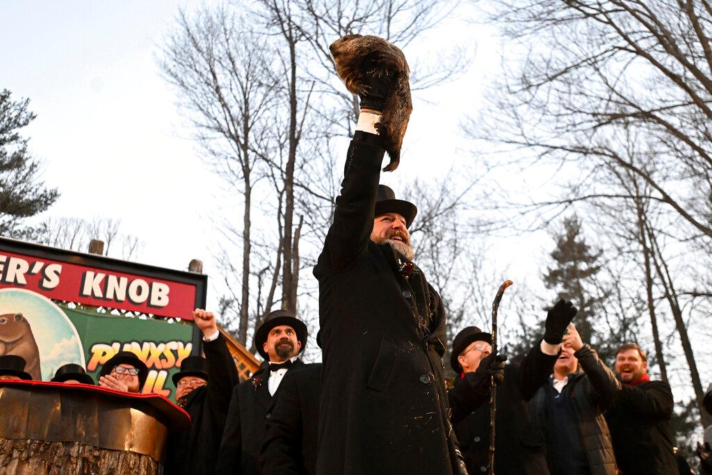 Groundhog Club handler A.J. Dereume holds Punxsutawney Phil, the weather prognosticating groundhog, during the 137th celebration of Groundhog Day on Gobbler's Knob in Punxsutawney, Pa.