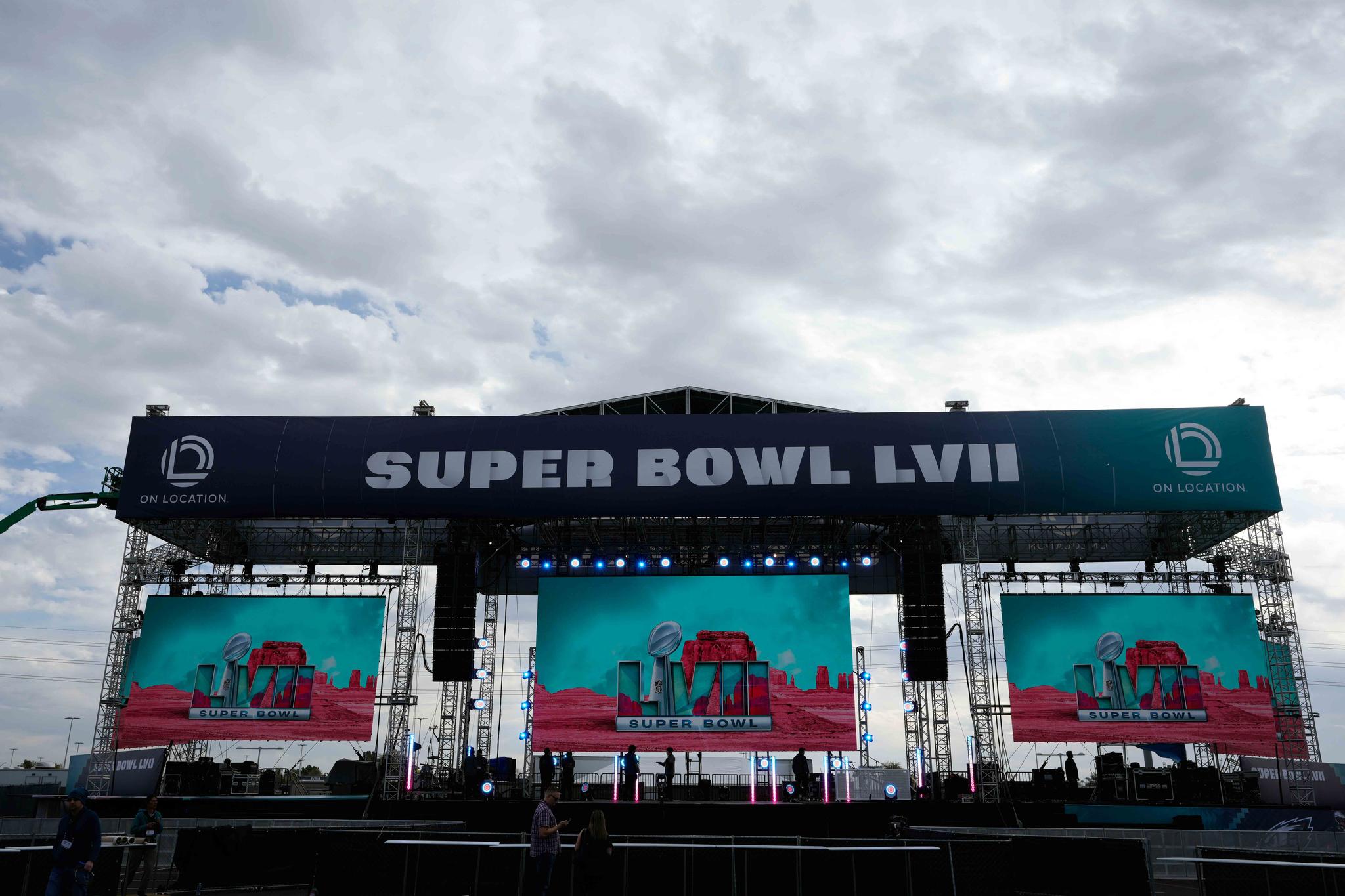 Logos are flashed on a stage outside State Farm Stadium ahead of Super Bowl 57 NFL football game Saturday, Feb. 11, 2023, in Glendale, Ariz.