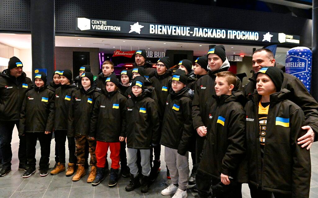 Ukrainian peewee hockey team players and coaches as they arrive at the Videotron Centre in Quebec City. The Ukraine team will compete at the Quebec international peewee hockey tournament.