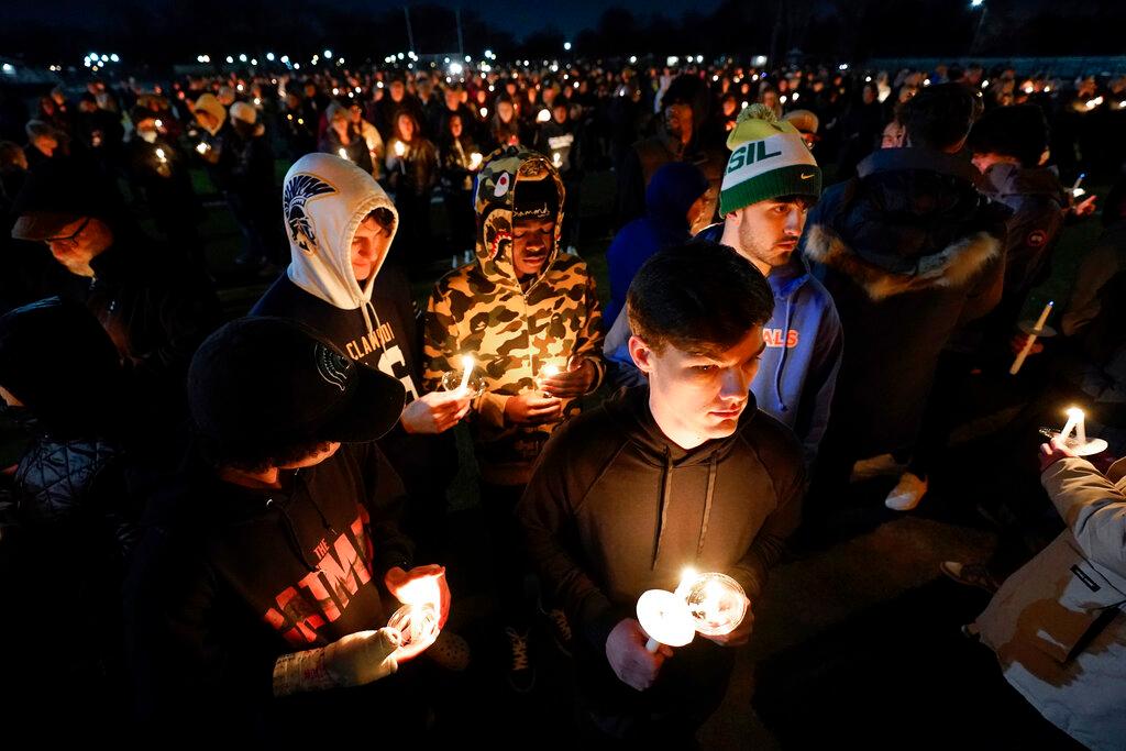 Mourners attend a candlelight vigil for Alexandria Verner at the Clawson High School football field in Clawson, Mich