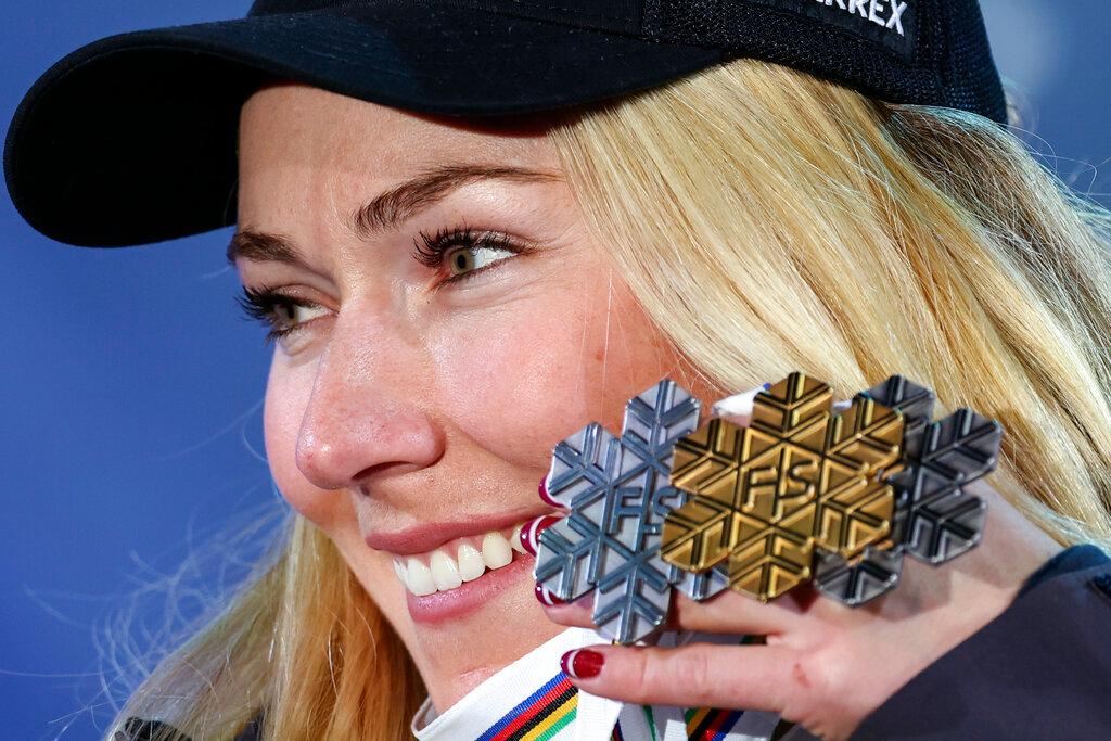 United States' Mikaela Shiffrin shows her silver medal of the women's World Championship slalom, the gold medal of the giant slalom and the silver of the combined, in Meribel, France, Saturday Feb. 18, 2023.