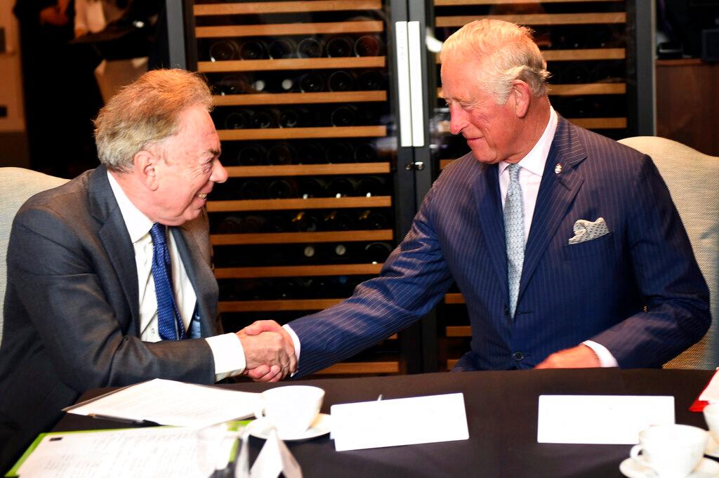 Britain's Prince Charles meets Andrew Lloyd Webber during a visit to the Royal Albert Hall to discuss the arts and creativity in school, in London, Wednesday, Sept. 5, 2018. Andrew Lloyd Webber, the English composer who created the scores for blockbuster musicals such as “Cats,’’ “The Phantom of the Opera’’ and “Evita,’’ has written the anthem for King Charles III’s coronation, adapting a piece of church music that encourages singers to make a “joyful noise.”