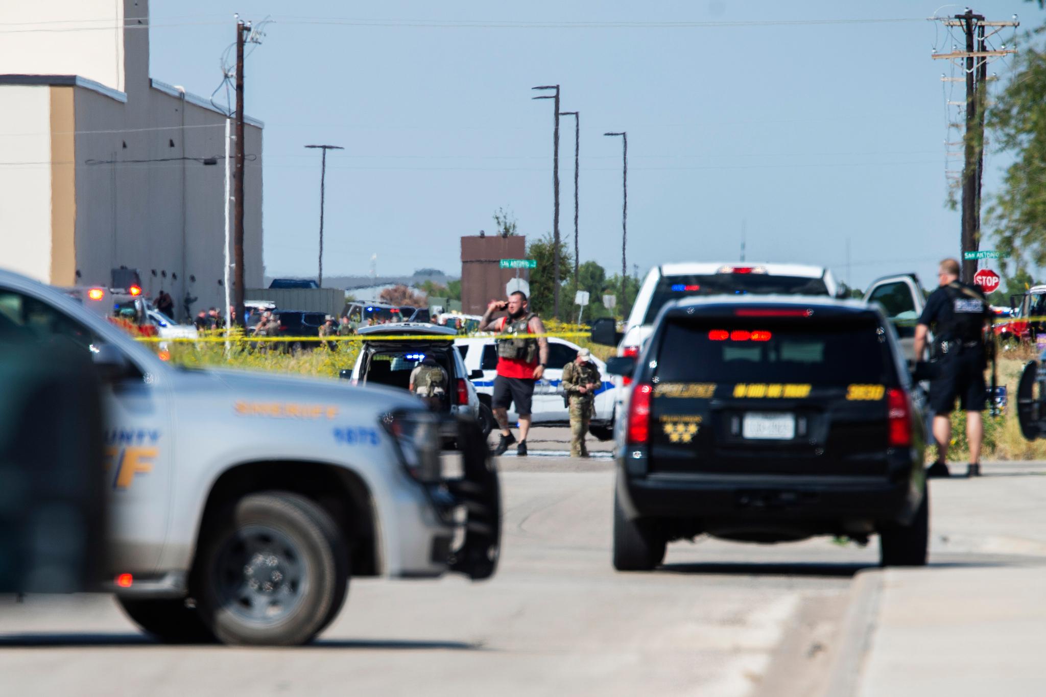 Odessa and Midland police and sheriff's deputies surround the area behind Cinergy in Odessa