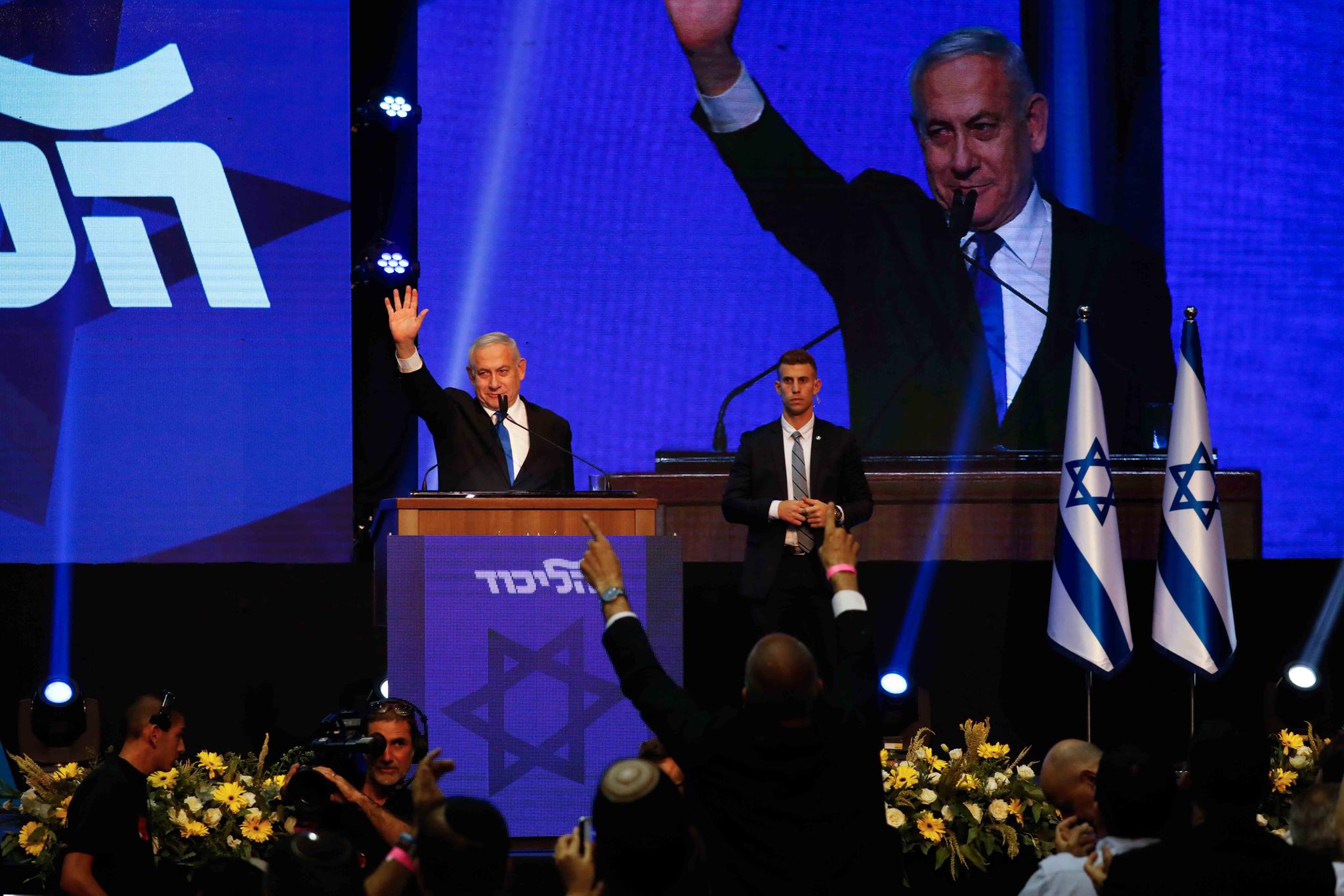 Israeli Prime Minister Benjamin Netanyahu addressees his supporters at party headquarters after elections in Tel Aviv