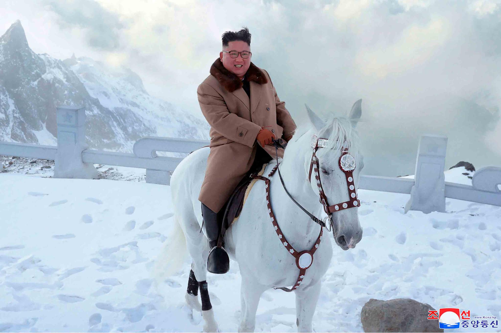 North Korean leader Kim Jong Un rides a white horse to climb Mount Paektu, North Korea