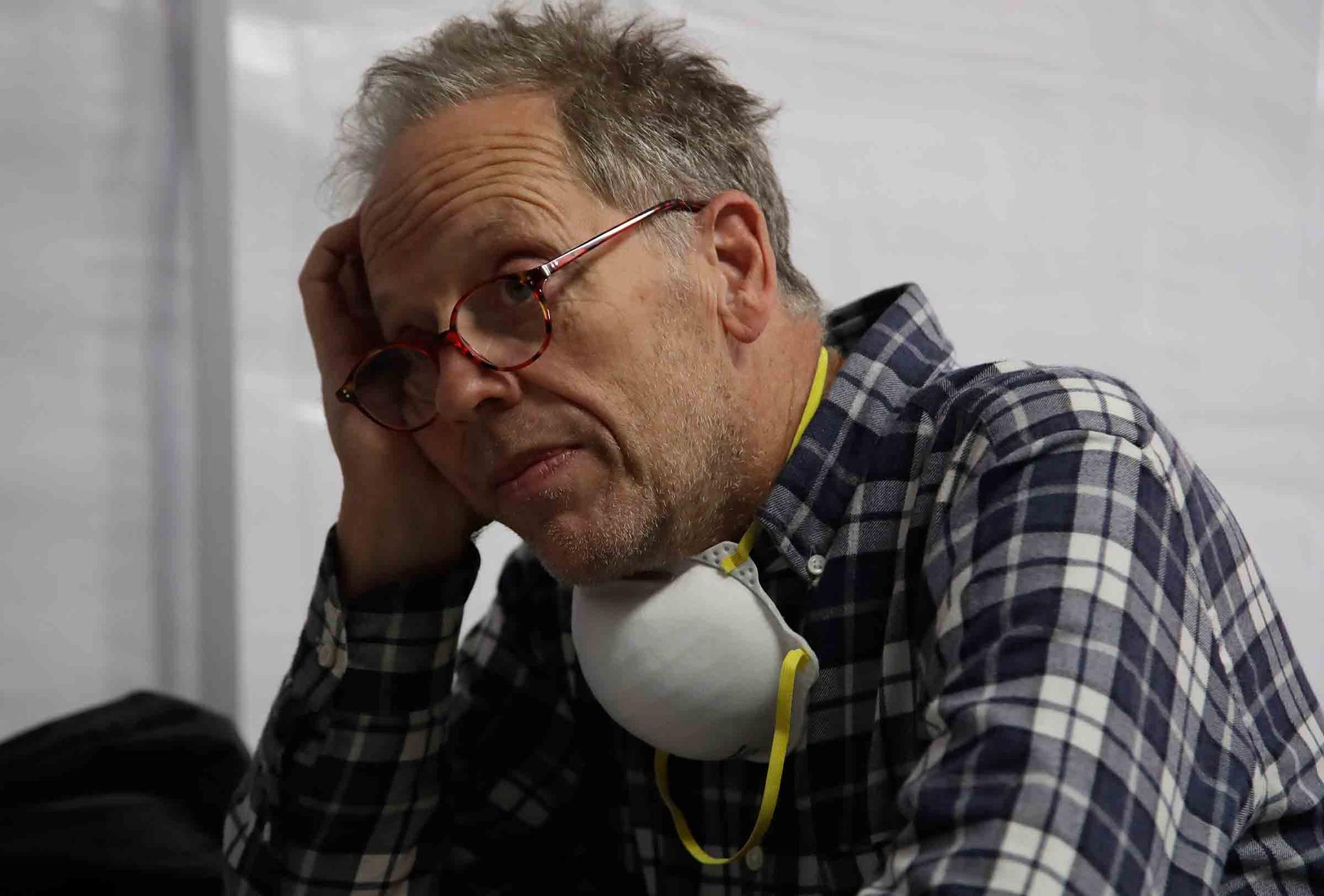 Mark Kaiser waits for his phone to charge at a Pacific Gas & Electric Co. community resource center