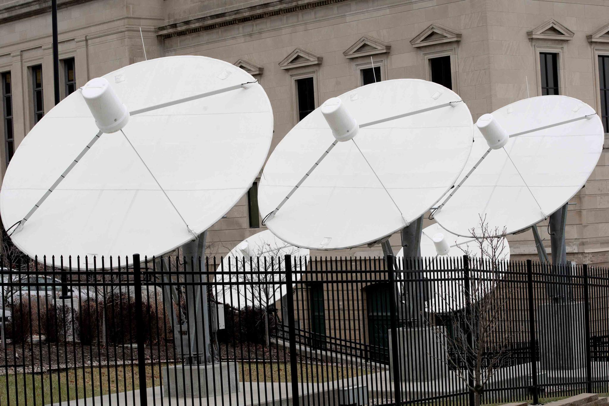 Satellite dishes are seen on the property of KETV, an ABC-affiliated television station in Omaha