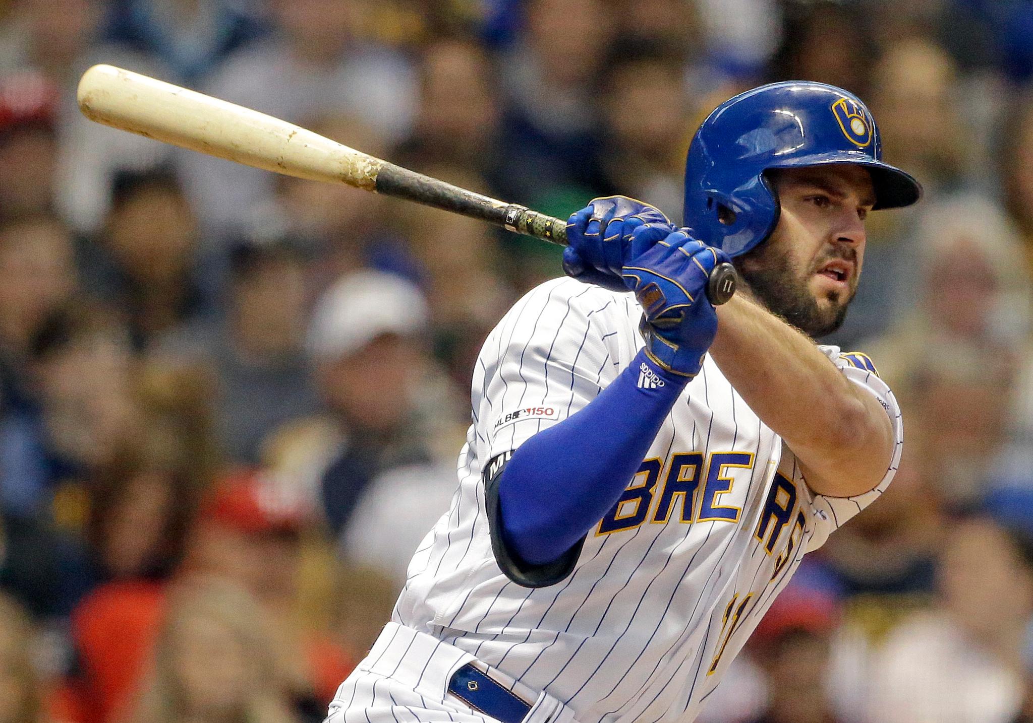 Mike Moustakas swinging a bat