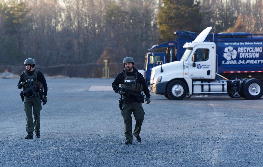 Winston-Salem Police officers in tactical gear patrol outside the Joycelyn V. Johnson Municipal Services Center after reports of gunshots in Winston-Salem, N.C. early Friday, Dec. 20, 2019. Winston- Salem Police are confirming there was a shooting but are not saying at this time if there are any injuries or deaths