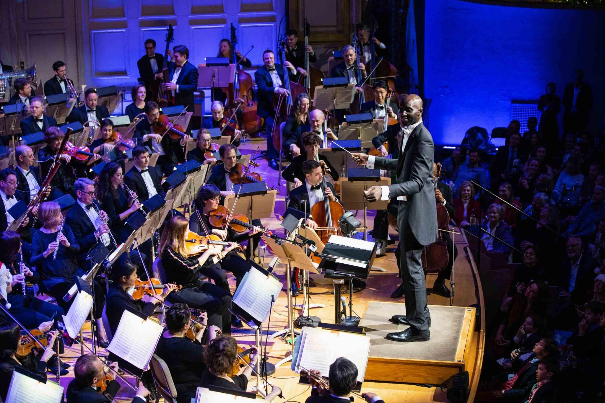 photo provided by Boston Pops, Boston Celtics player Tacko Fall makes his debut as a guest conductor during the renowned Boston Pops orchestra's holiday concert in Boston