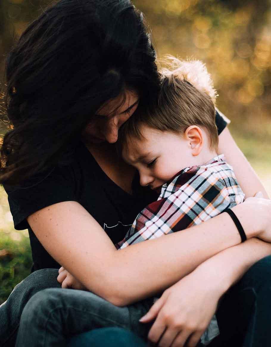 Woman hugging boy